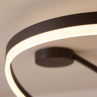 Soleno Circle Ceiling Light - macro close-up of LED acrylic diffuser band glowing warm white against cream plaster ceiling