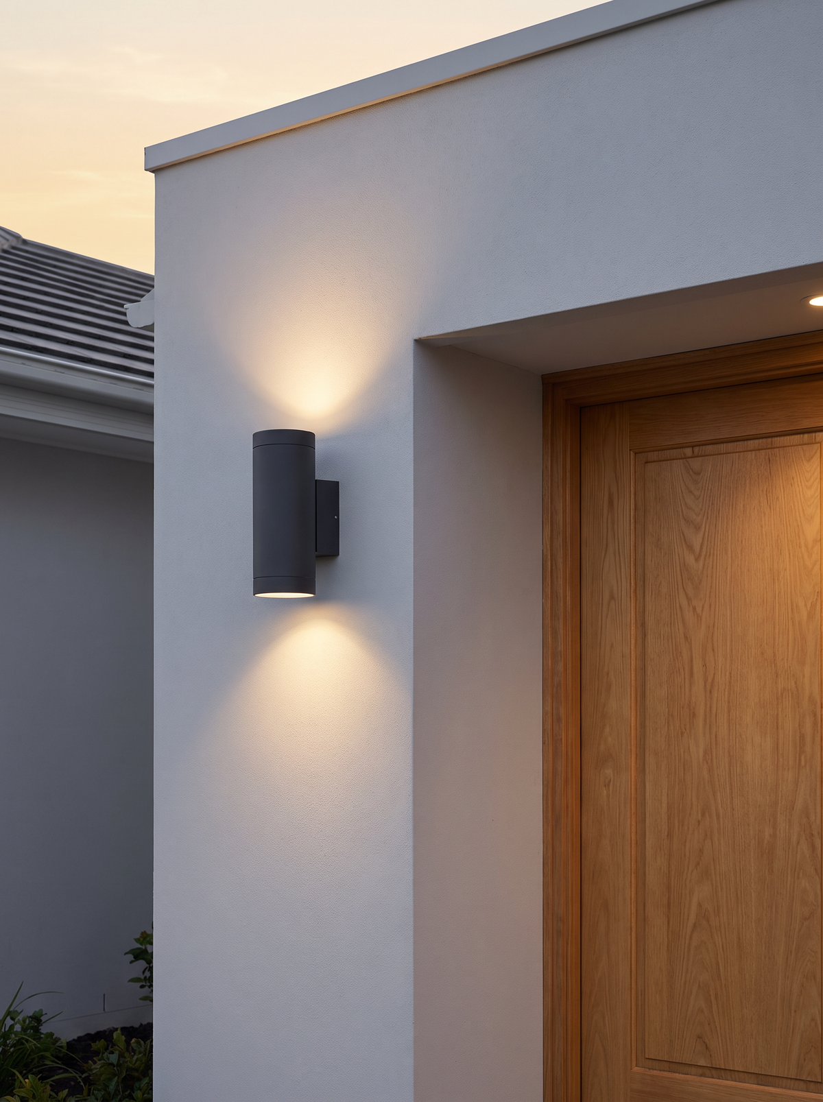 Tovi Twin-Beam Outdoor Wall Light - scale shot at dusk beside natural oak front door on rendered wall