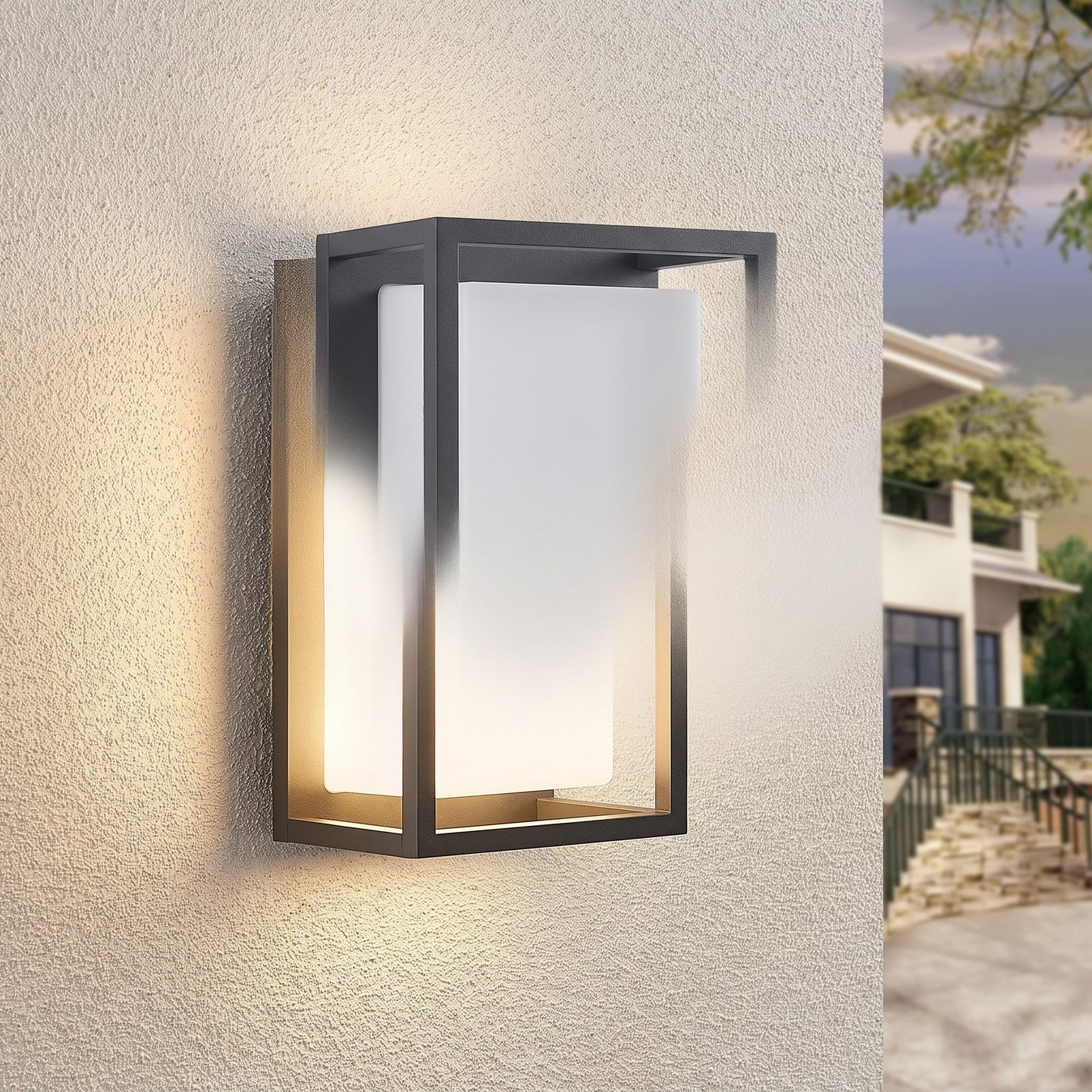 Ilia LED wall light glowing on a stucco wall