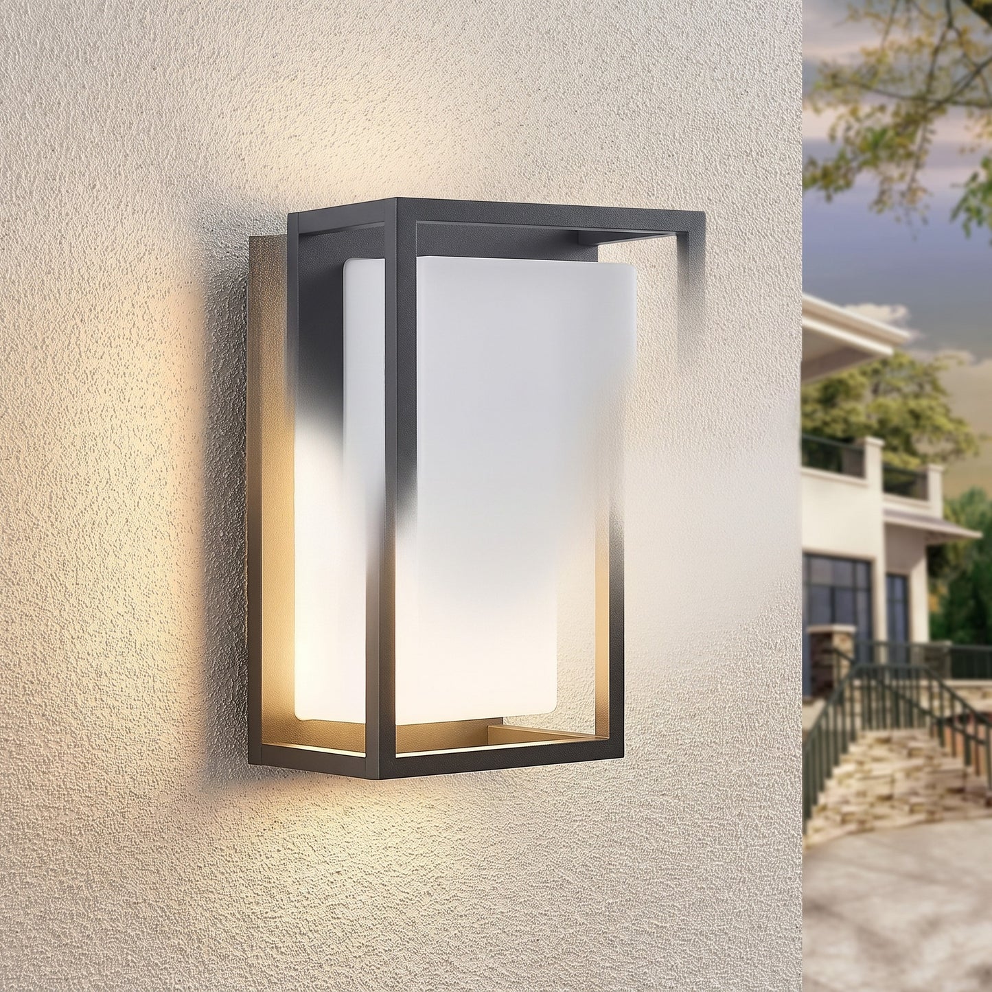 Ilia LED wall light glowing on a stucco wall