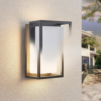 Ilia LED wall light glowing on a stucco wall