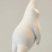 Close view of a moulded white resin bear hanging from the balloon cord of the Wisto ceiling light