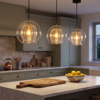 Juna glass globe pendants over a kitchen island