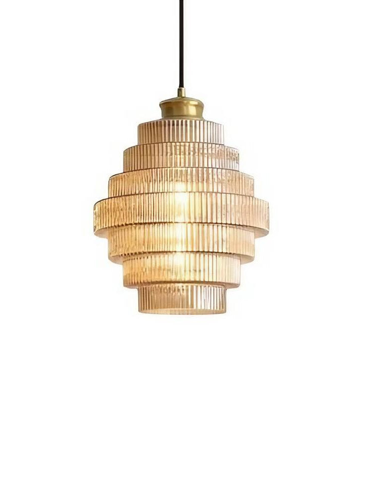 Idra ribbed amber glass pendant light with stepped tiers and gold-tone cap on a plain background