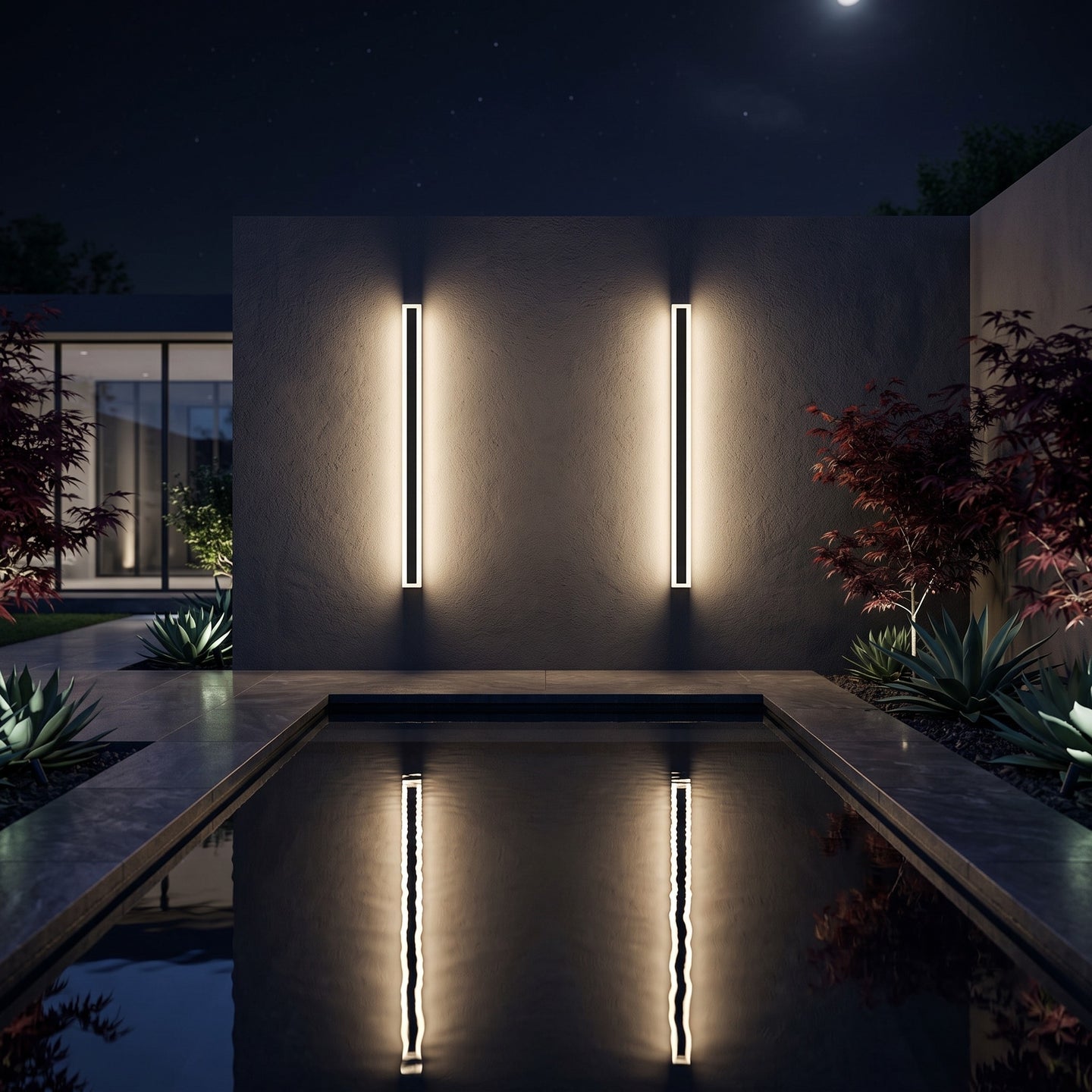 Vina wall lights over a courtyard reflecting pool at night