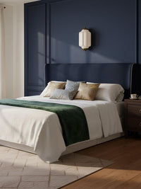 Faro Flush Milk Glass Wall Light on a navy panelled bedroom wall above the bed