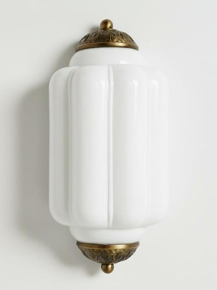 Faro Flush Milk Glass Wall Light with ribbed white glass shade and aged copper caps on a white background
