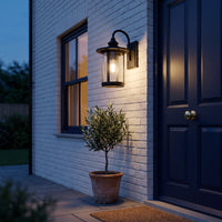 Zaya lantern on a brick porch wall